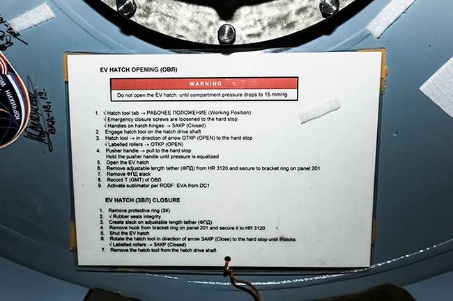 Signs on ISS. Instructions on EV hatch opening. English language