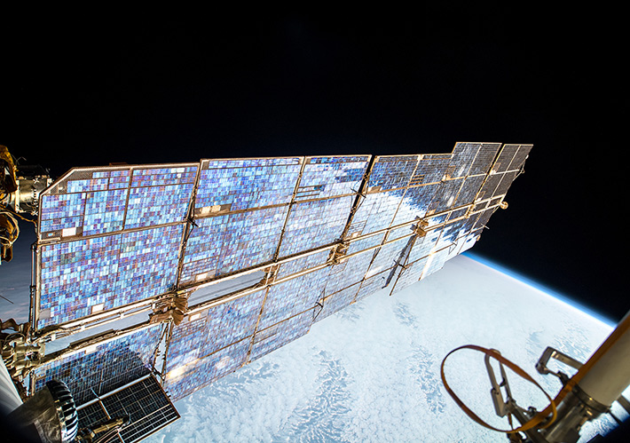 ISS Solar Arrays over Earth